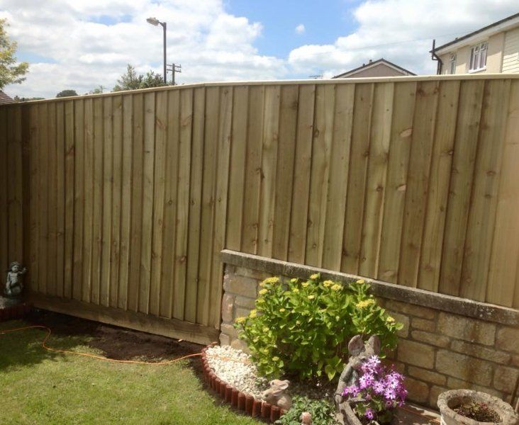 A close up of iron railings that have been painted grey